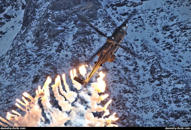Cougar solo display shooting flares over Axalp