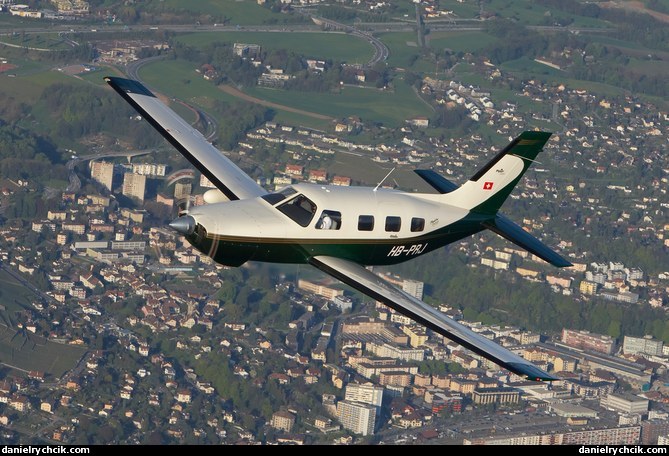 Piper Malibu HB-PRJ over Vaud
